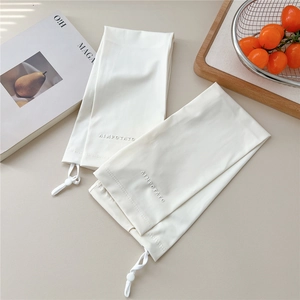 Detail view of white ice silk sun sleeves featuring adjustable drawstring and embossed logo