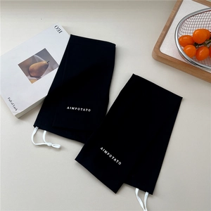 Detail view of black sun protection cooling sleeves with adjustable white drawstring toggle