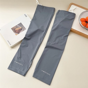 Detail of dark gray sun protection sleeves with adjustable drawstring and logo
