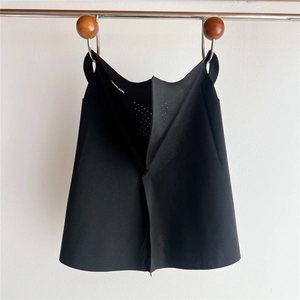 Detail view of black sun protection face mask featuring breathable laser-cut vent holes