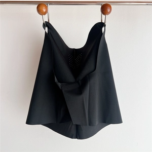 Detail of laser-cut black seamless cooling sun protection neck gaiter with matte texture