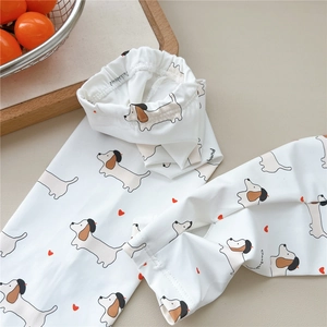 Close-up of white sun protection sleeve with cute dachshund dog print and heart detail