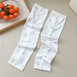 Close-up of white sun protection sleeves with cute cat print and breathable fabric texture