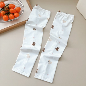 Close-up of white sun protection ice silk sleeves with cute cartoon dog patterns