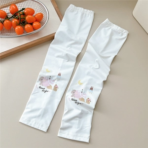 Close-up of white sun protection sleeves with cute bear patterns and Good Night text