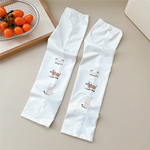 Detail of white cooling arm sleeves with cute cartoon puppy and rabbit prints