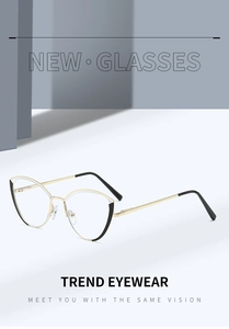 Detail of trendy gold cat eye metal frames with stylish black accents on the temple tips