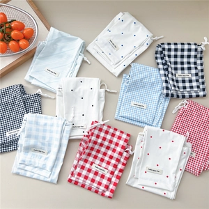 Manchettes de protection solaire avec motifs à carreaux et pois et cordon de serrage