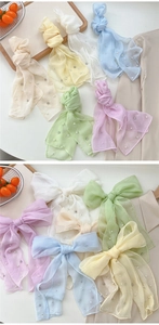 Detail of candy-colored chiffon ribbons with pearl and rhinestone accents