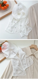 Detail of white semi-transparent pearl scarf with rhinestones for elegant styling
