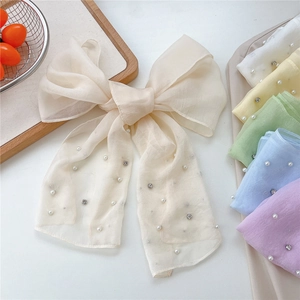 Elegant organza bow scarf with pearls and rhinestones shown in various candy colors