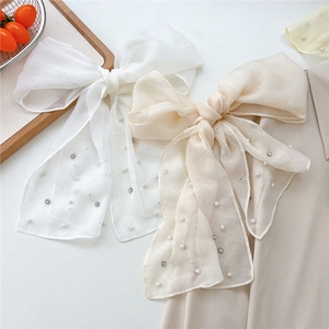 Elegant large organza bow hair clip with white pearls and long ribbons in candy colors