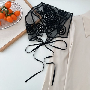 Detail of black floral lace headband with intricate embroidery and delicate ties