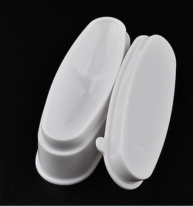 Detailed view of white plastic French nail dipping powder container with lid
