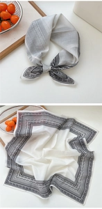 Détail macro d'un foulard en soie de 53cm avec imprimé géométrique noir et blanc élégant