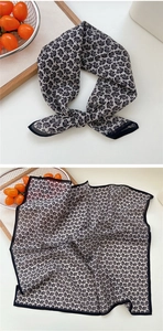 Détail d'un foulard carré de 53 cm avec motif Paisley noir et blanc et ourlet roulé fin