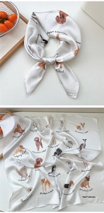 Detailed view of square silk scarf with diverse dog breed prints and character descriptions