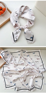 Detail of satin square scarf featuring cartoon dachshund prints and Bonjour lettering
