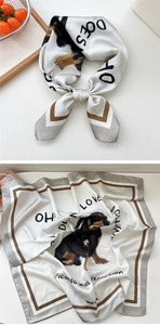 Detailed view of square silk scarf featuring dachshund portrait and Picasso quote print