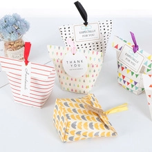 Detailed set of assorted patterned candy boxes with colorful ribbons and gift tags