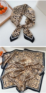 Detail of silk scarf featuring animal print leopard and zebra patterns with border