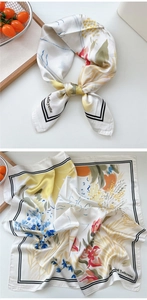 Detailed macro view of silk square scarf with hand-painted floral prints and border lines