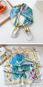 Detail of artistic floral silk scarf with vibrant butterfly prints and satin finish texture
