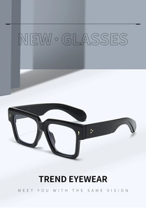Detailed macro view of black square frame eyewear with silver metal rivets on the temples