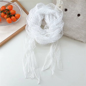 Detailed view of white polka dot lace scarf with elegant mesh texture and floral pattern
