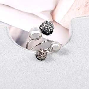 Macro detail of silver spiral wrap ring with polished beads and dark grey pave rhinestones