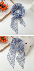 Close-up of blue plaid mesh scarf showing lightweight transparent fabric texture