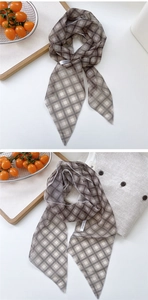 Detailed view of coffee plaid mesh scarf with fine hem and DN&KW woven brand label