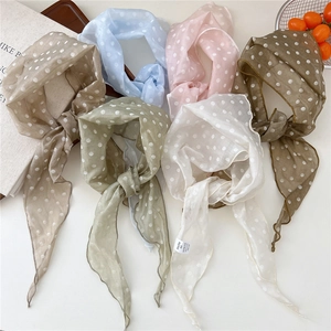 Polka dot thin scarf set in various colors shown in a flat lay arrangement on a desk