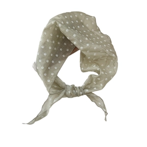 Polka dot silk neck scarf in light khaki green with a stylish tied knot design