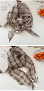 Détail d'un foulard en lin rayé transparent au style vintage élégant et rétro