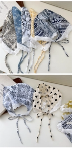 Detailed view of lace-trimmed cotton linen triangle scarf with heart crochet patterns
