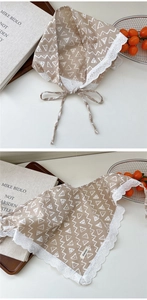 Close-up of heart lace trim and geometric prints on cotton linen scarf detail