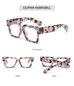 Detail of pink hawksbill square glasses frames with golden arrow rivets and studs