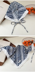 Close-up of geometric print cotton linen headscarf with delicate white lace edges