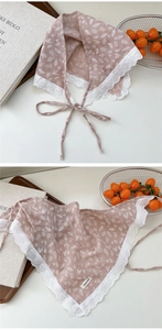 Detail of floral cotton neck scarf with lace trim and strap in dusty pink finish