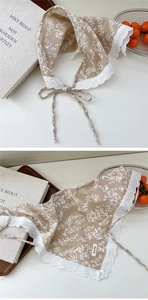 Close-up of vintage floral cotton headscarf with delicate white lace trim and ties