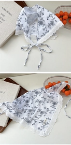Detail of floral cotton scarf showing delicate lace trim and vintage pattern textures