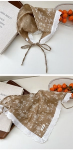 Close-up of heart lace cotton linen triangle scarf with white floral embroidery