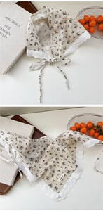 Close-up of heart lace trim and floral patterns on vintage cotton linen neck scarf