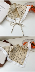 Detailed macro view of vintage floral cotton linen bandana with white lace embroidery edges