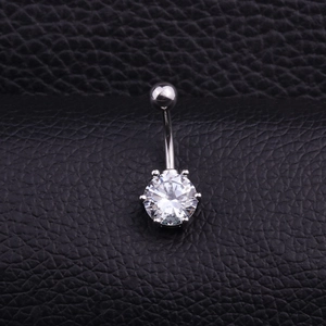 Macro shot of silver belly ring featuring a large round cubic zirconia on black leather