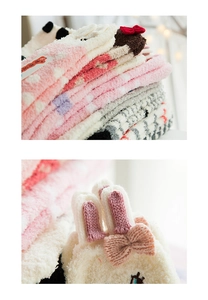 Detail of coral fleece winter socks with 3D bunny ears and cute cartoon embroidery
