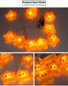 Detail of warm yellow LED star string lights with smiley faces and battery power box