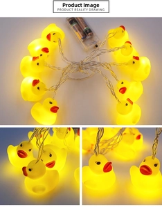 Detail of battery-powered yellow duck LED string lights with warm glowing animal shapes