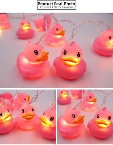 Detailed macro view of pink duck-shaped LED string lights with warm yellow light points